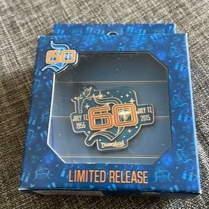 Disneyland 60th anniversary Limited Release Collectors Pin in box.